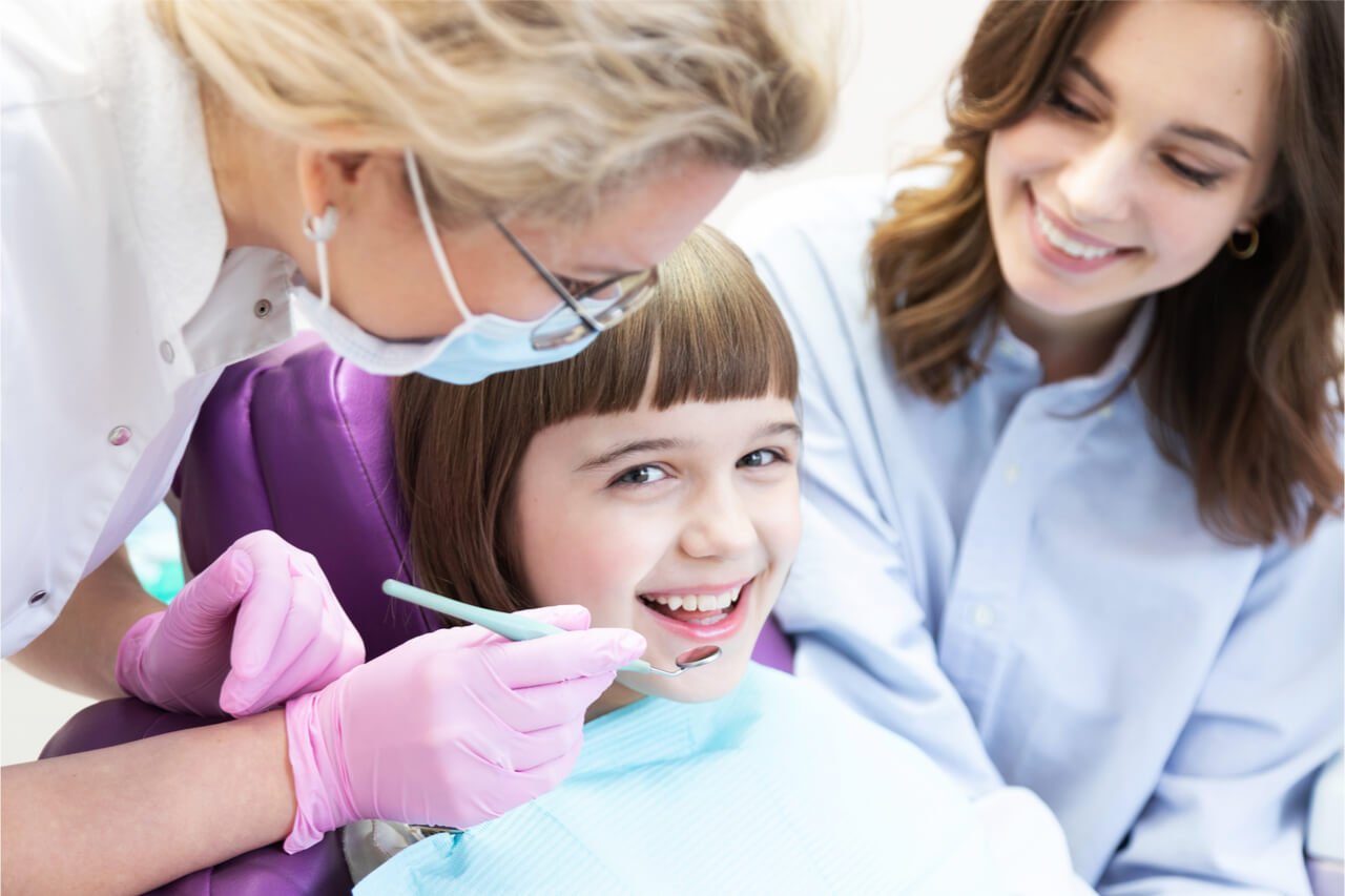 young girl with dentist